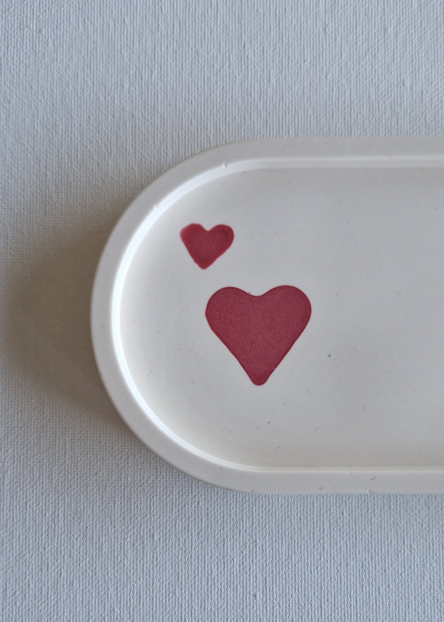 The Oval, Cream with raspberry hearts